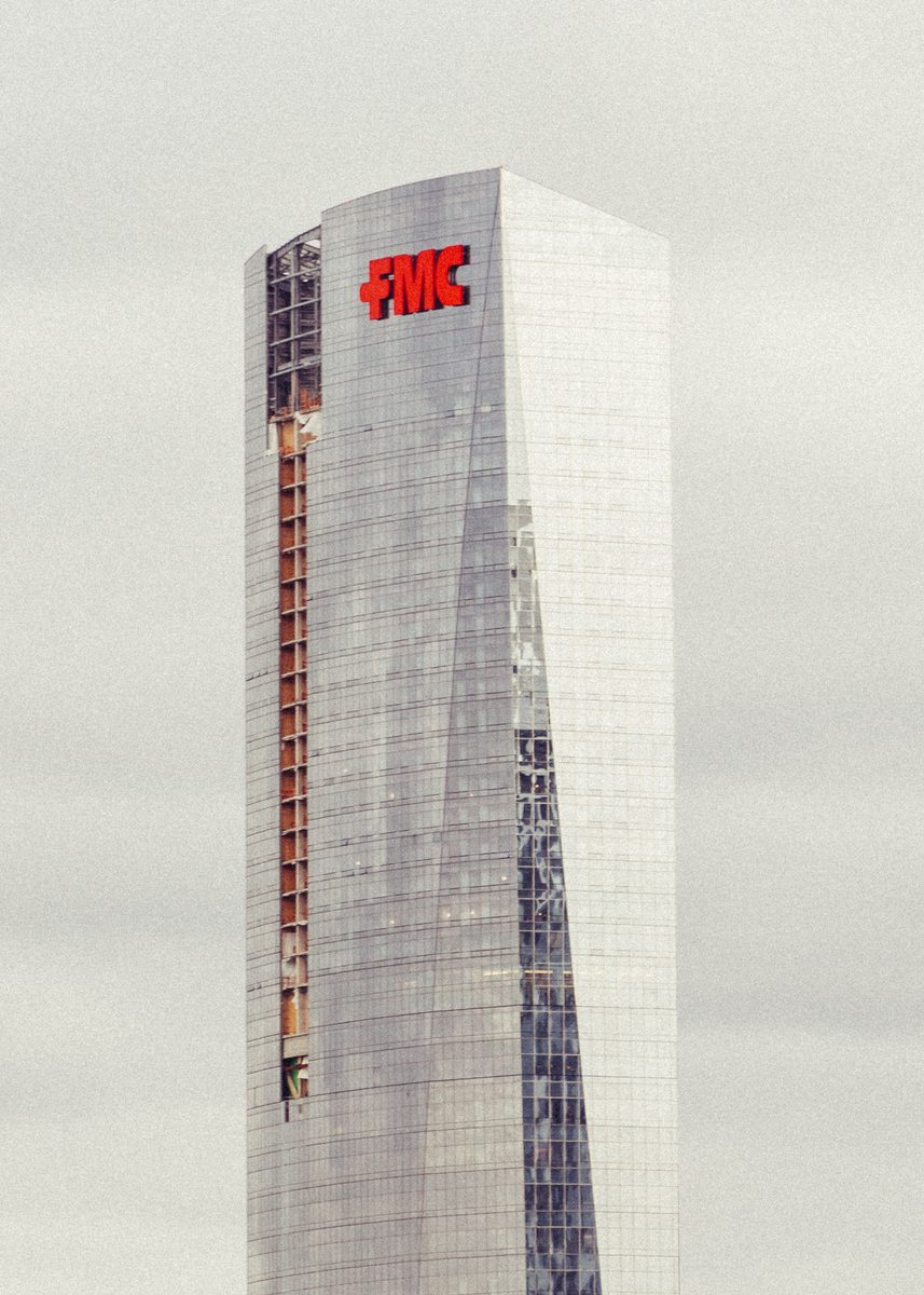 The upper floors of the FMC Tower against a blank overcast sky.